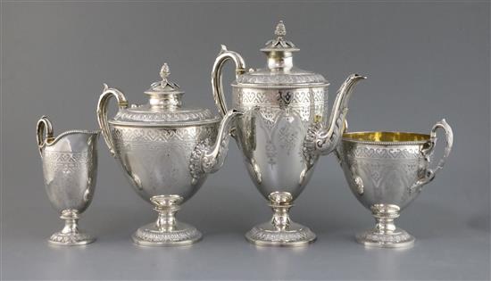 An ornate Victorian silver pedestal four piece tea and coffee service by Martin, Hall & Co, gross 85.5 oz.